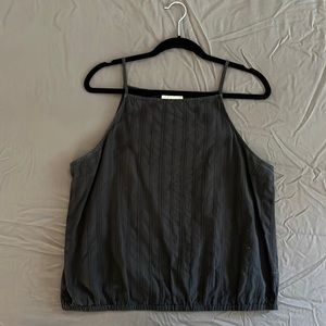 High neck black tank with texture detail and cinched bottom